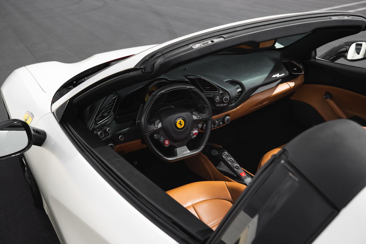 services-03 Explore the sleek design and luxury interior of a Ferrari convertible, ideal for automotive enthusiasts.