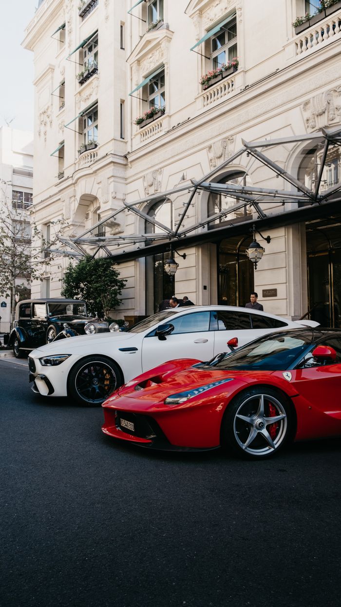 Crafting Captivating Headlines: Your awesome post title goes here A lineup of luxury sportscars parked in front of a classic Parisian building.